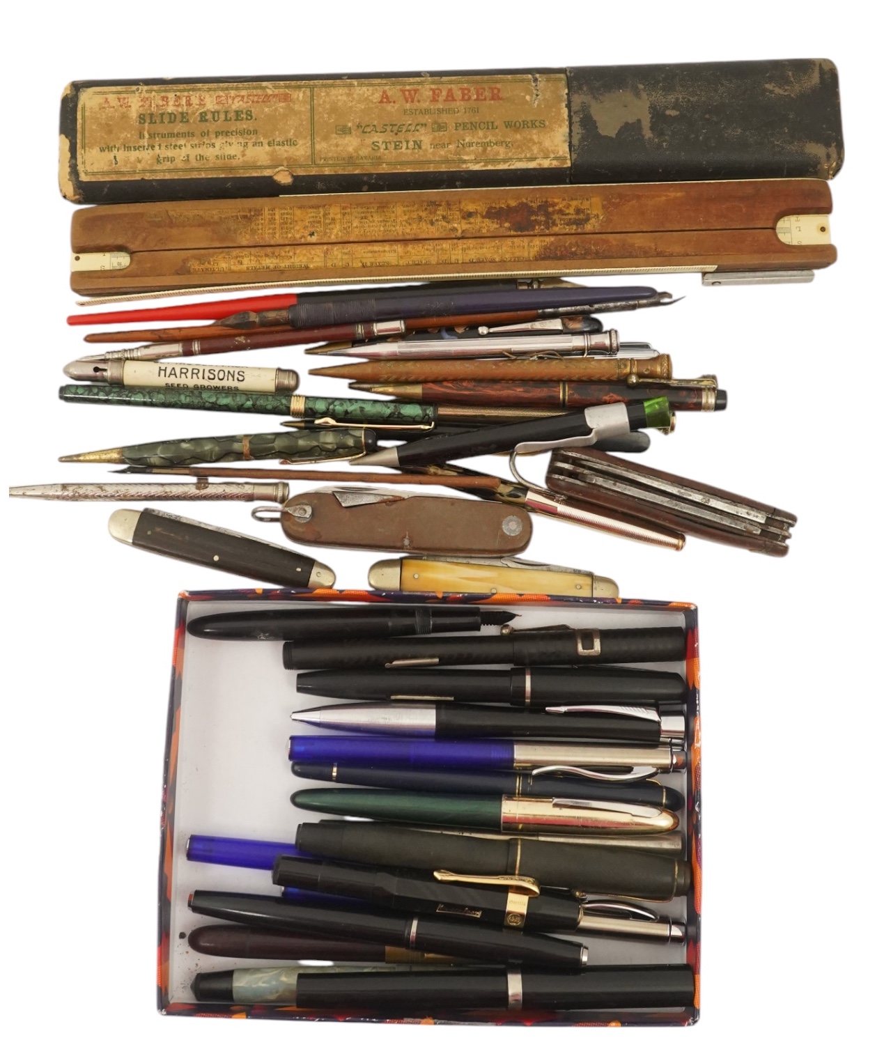 A collection of pens, etc. from 1950's and later and a collection of propelling pencils from 1930's and later, four penknives and a slide rule